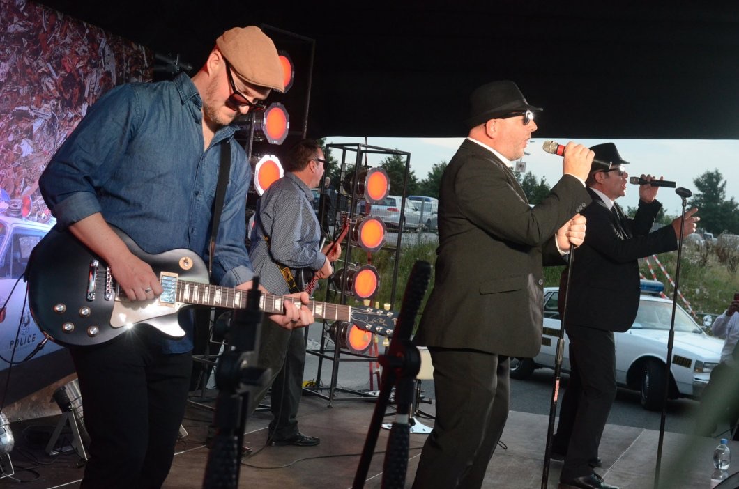 The four-piece Blues Brothers tribute band performing at Paderborn Airport in Germany
